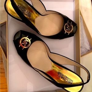 Michael Kors Black peep toe wedge.